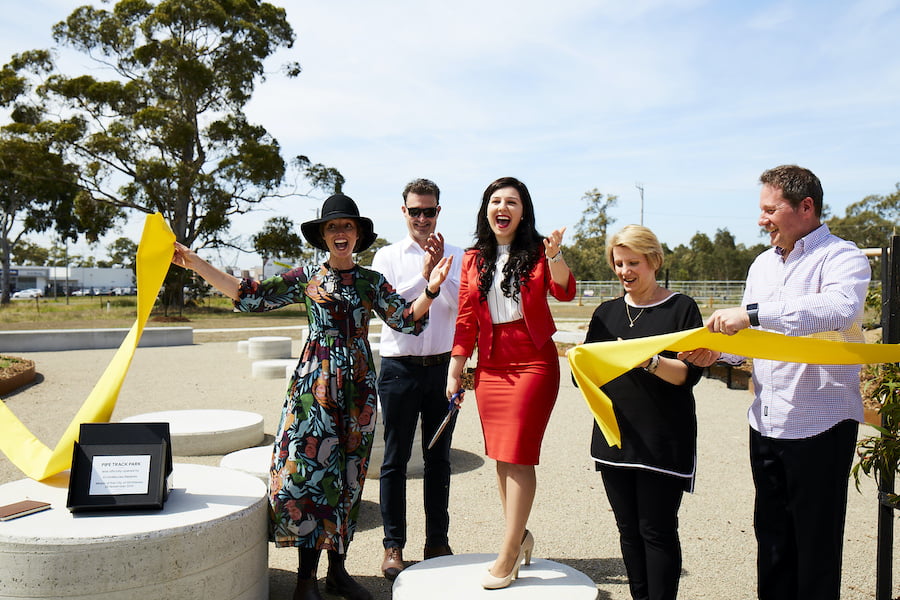 cutting the ribbon at green joy park